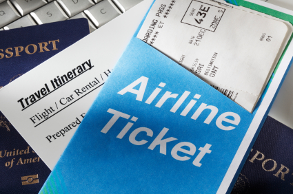 Airline ticket and travel itinerary on top of a passport, symbolizing seamless travel experiences and high-touch service in luxury travel.